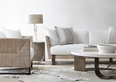 bernhardt interiors living room with beige and white color palette, sofas, lamp, and coffee table