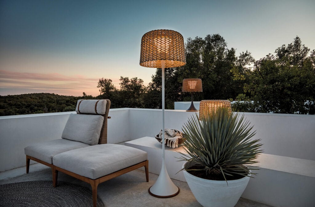Three Lamps Next to Lounge Chairs Outdoors