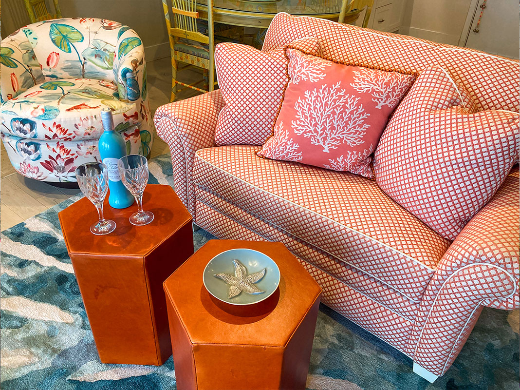 A teal and coral coastal living room 